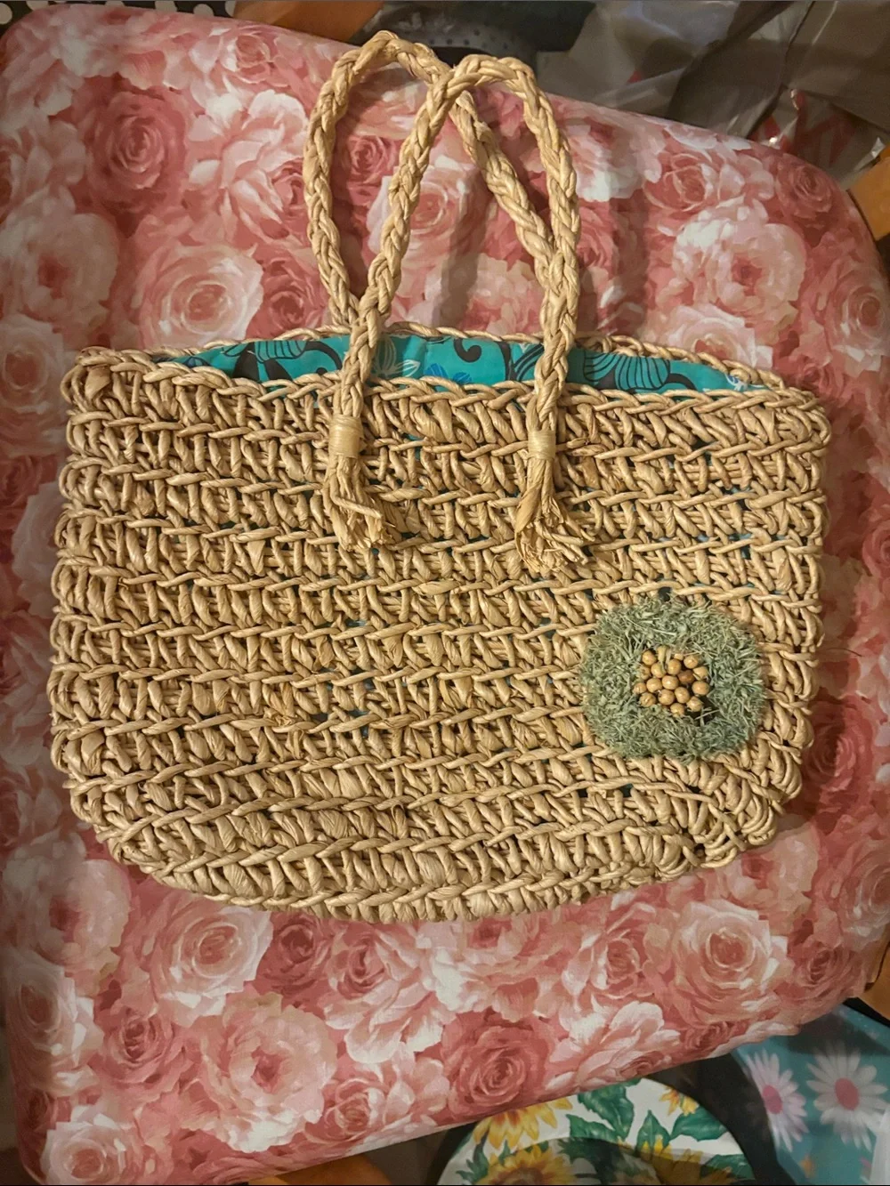 Woven Straw Tote Bag with Turquoise Lining and Decorative Accent